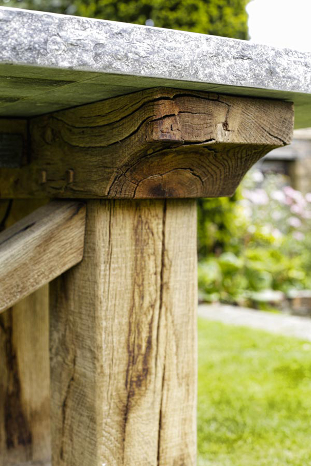 Oak table detail with stone top by Oxenwood outdoor furniture