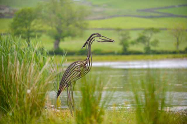 Heron by lake by Andrew Kay sculpture